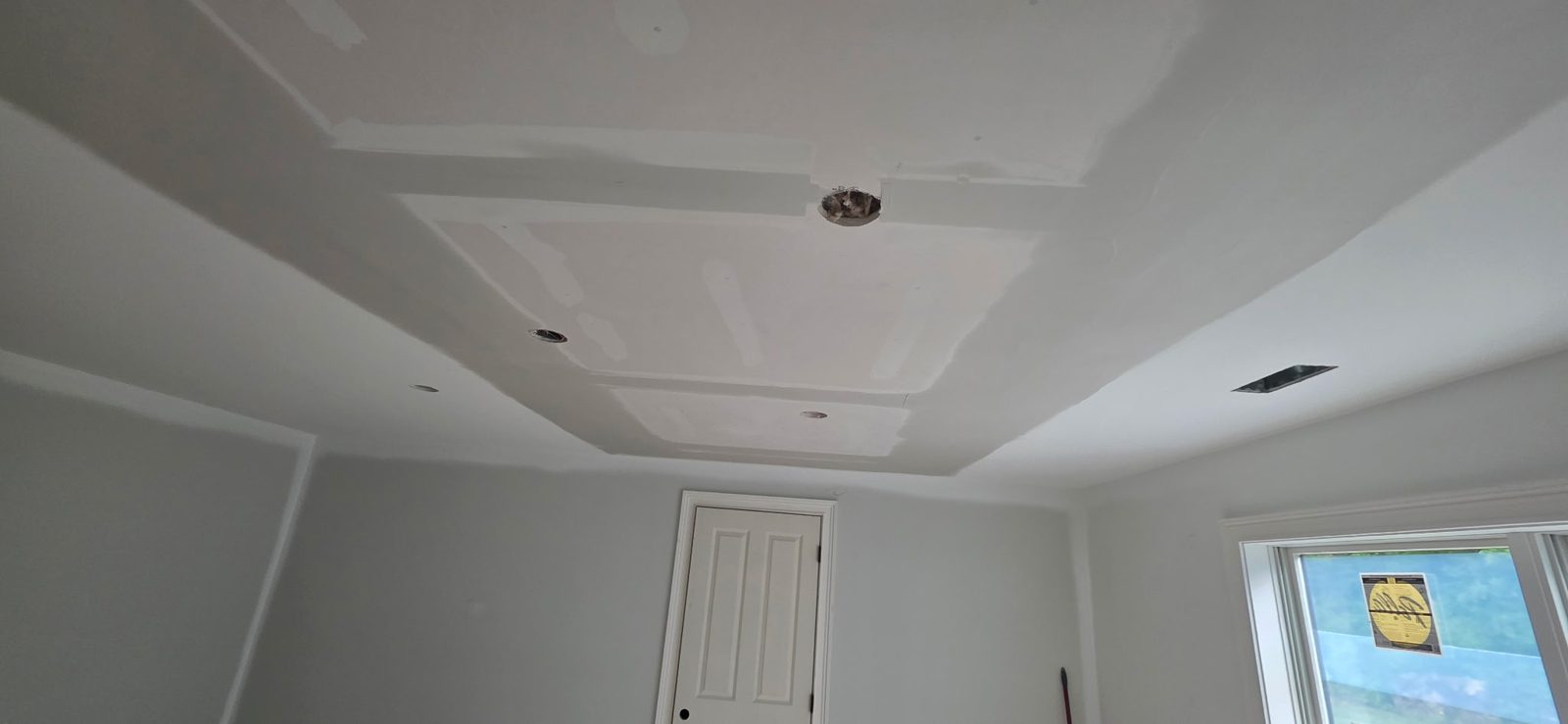 Drywall patch and finish work on a residential ceiling